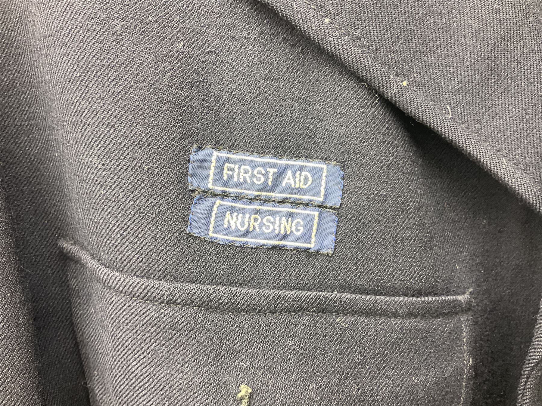 1950s British Red Cross North Yorkshire dress uniform comprising tunic, trousers, greatcoat and visor cap; bears manuscript label '1956 Ware'