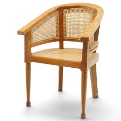 Late 20th century Anglo-Indian teak framed bergère armchair with canework back and seat, r...