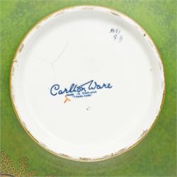 Carlton Ware bowl on stand decorated with Oriental dragon on a green and gilt ground D24cm