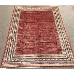 Large Persian Araak red ground rug, multiple band border, repeating boteh motifs field, 392cm x 284cm 