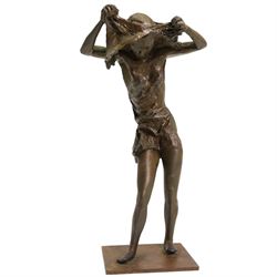 Hylton Stockwell (British): Limited edition bronze sculpture of a woman pulling a shirt over her head, signed and dated 2002, 2/4, H22cm