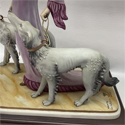 Capodimonte figure Ester, modelled of a lady with two dogs, upon a stepped wooden base, H45cm