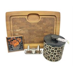 Danish collectables, to include teak tray by Nissen Denmark, ladybird pattern biscuit barrel by Laurids Lonborg and a Stelton stainless steel and wooden cruet set, together with a mid century floral tile trivet