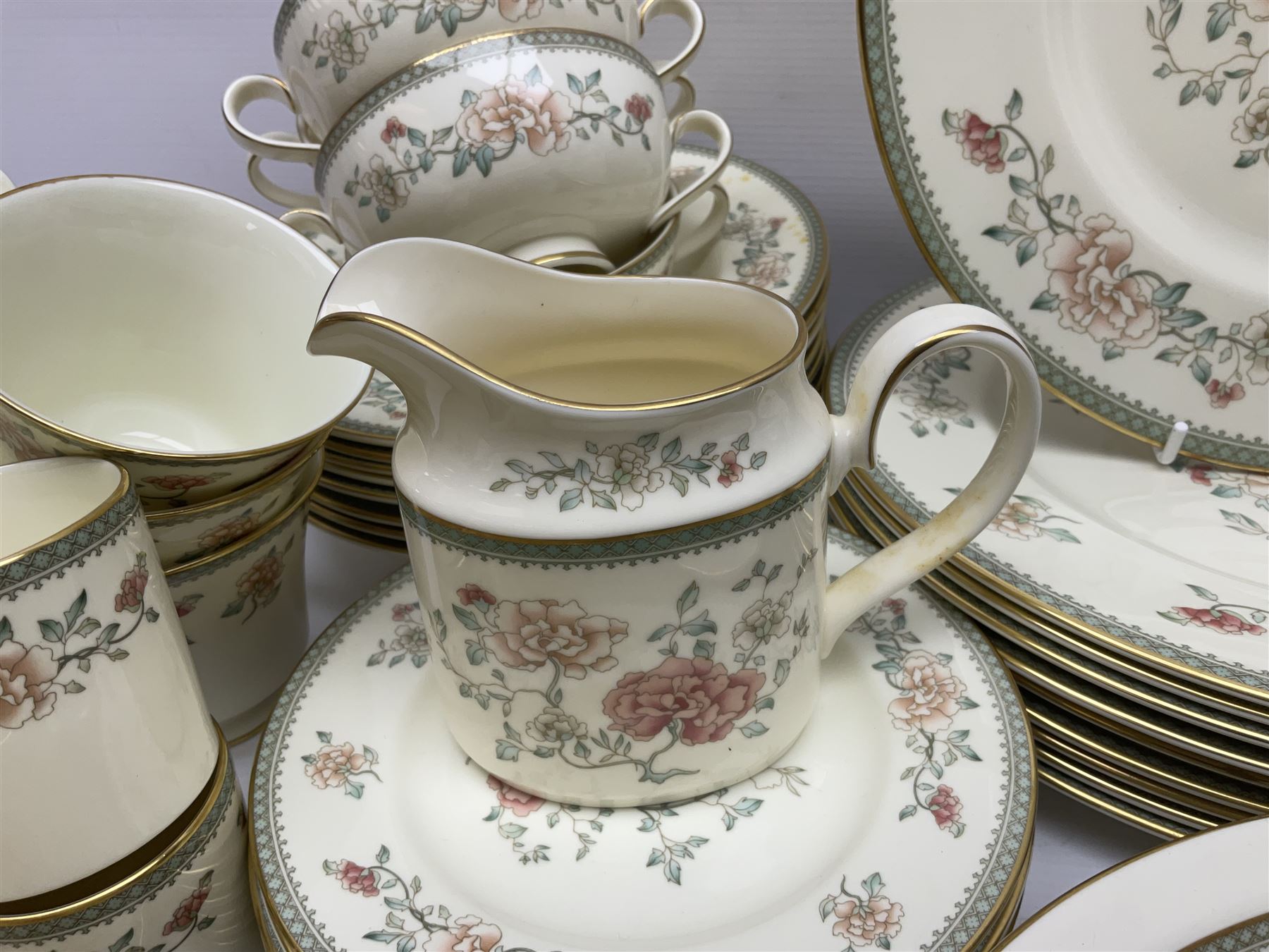 Minton Jasmine pattern tea and dinner wares, including dinner plates, sauce boats, side plates, bowls, teacups, coffee cans and twin handled soup bowls, etc (122)
