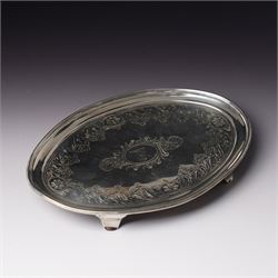 George III Irish silver oval teapot stand engraved with garlands scrolls and central crest...