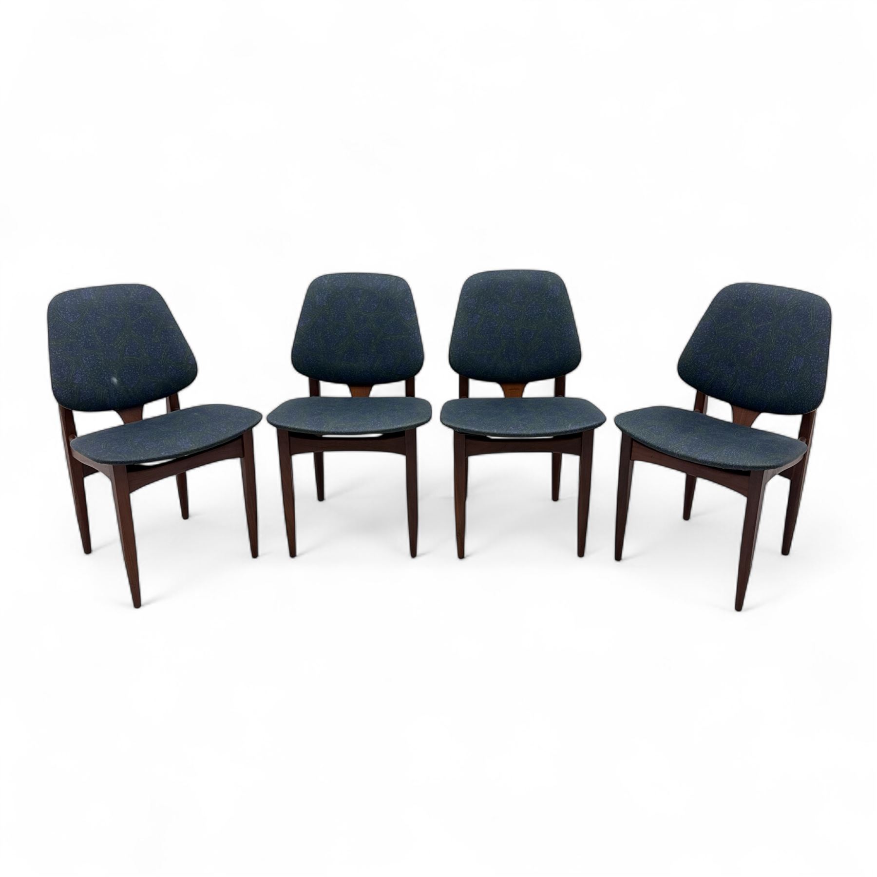 G-Plan - mid-20th century teak oval dining table, with butterfly leaf extension mechanism and four Elliot's of Newbury teak framed dining chairs upholstered in purple and green fabric, table un-extended width 152cm x depth 152cm x height 71cm, chairs 47x37x78cm 