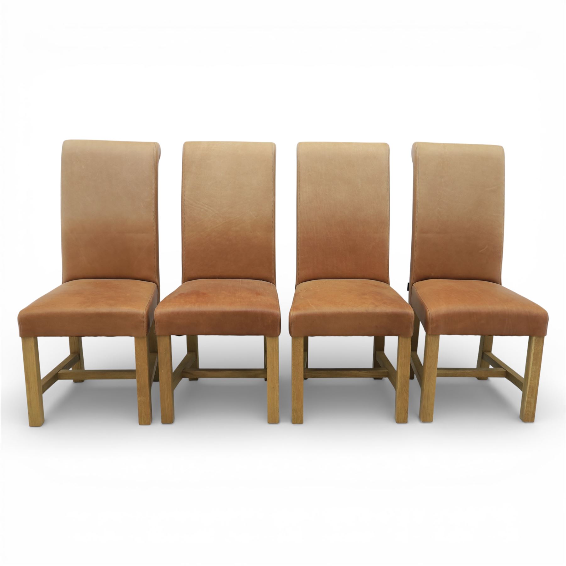 Modern large oak plank top dining table and twelve brown leather high back chairs, table of rustic construction five solid planks with exposed supports, the chairs in brown leather hide with ten standard height and a pair of taller chairs for the foot and head of the table