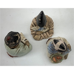 Three Japanese earthenware nodding head figures, each modelled as a seated male, tallest H13.5cm.  