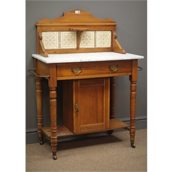  Edwardian marble top washstand, raised tiled back, single drawer, metal towel rail to the side, turned supports joined by an undertier with a cupboard enclosing a shelf, W87cm, H110cm, D45cm  