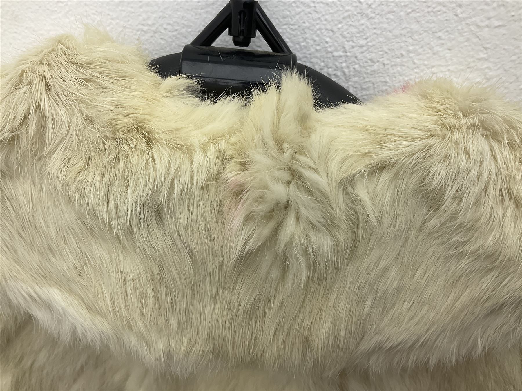 Brown mid length musquash fur coat by National Fur Company together with white rabbit cape