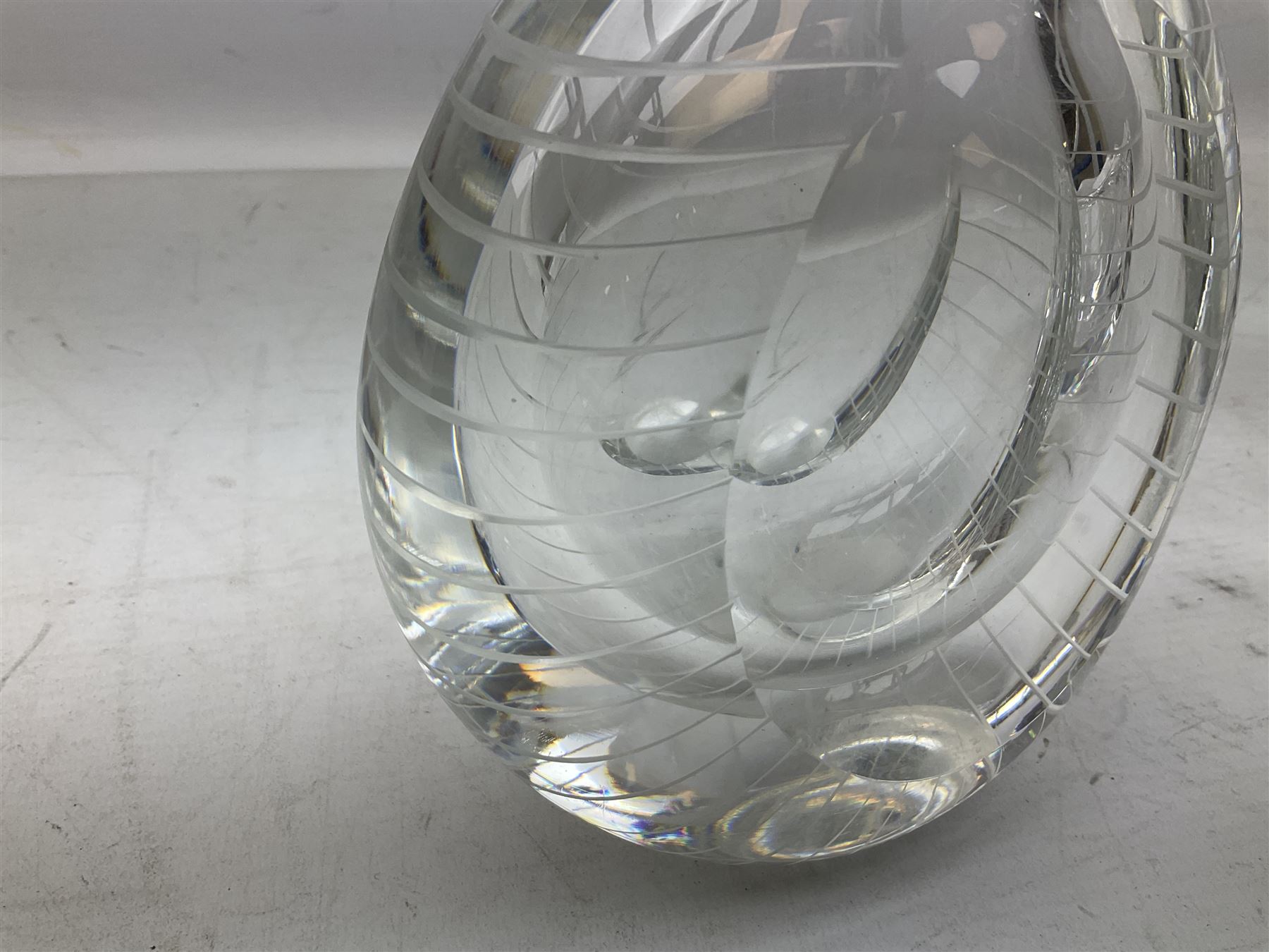 Two Orrefors Art Glass clear glass vases, the first example of compressed circular form, the second of tapering form with lobed rim, each signed beneath, tallest H14.5cm