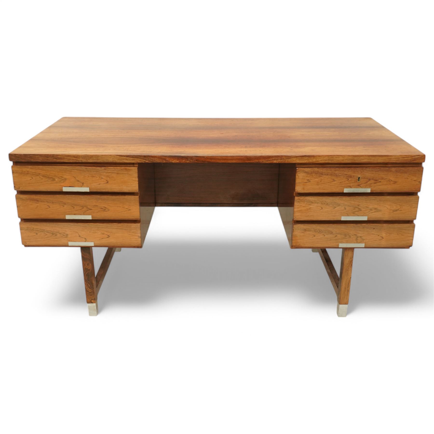 Mid-20th century rosewood pedestal desk, the rectangular top above twin pedestals each fitted with three drawers, all with recessed metal pulls, raised on square legs with stretcher supports and capped metal feet