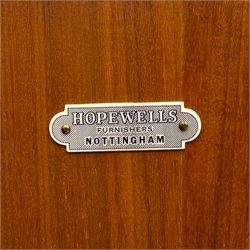 Richard Hornby for Fyne Ladye - mid-20th century afromosia teak sideboard, retailed by Heals of London, rectangular form, with low profile carved gallery lip, above three central drawers with ribbed drawer fronts, flanked by two cupboards with vertically grained doors and recessed pull handles, with streamlined moulded edges and sides, raised on tapered slender legs 