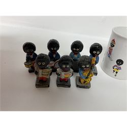 Fourteen Golly Band figures, eight labelled Robertson to base, and TAMS golly mug