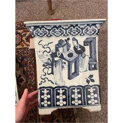19th century Chinese blue and white planter and stand, each of square slightly tapering and flared form, the planter decorated with figures and precious objects between stylised foliate borders, the stand decorated with landscapes beneath a lipped rim with cell band, planter H28cm D25.5cm, stand H7cm D26cm