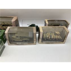Sixteen Atlas Editions die-cast models of military vehicles including six Ultimate Tank Collection; all in perspex display cases; fourteen boxed; with associated paperwork (16)