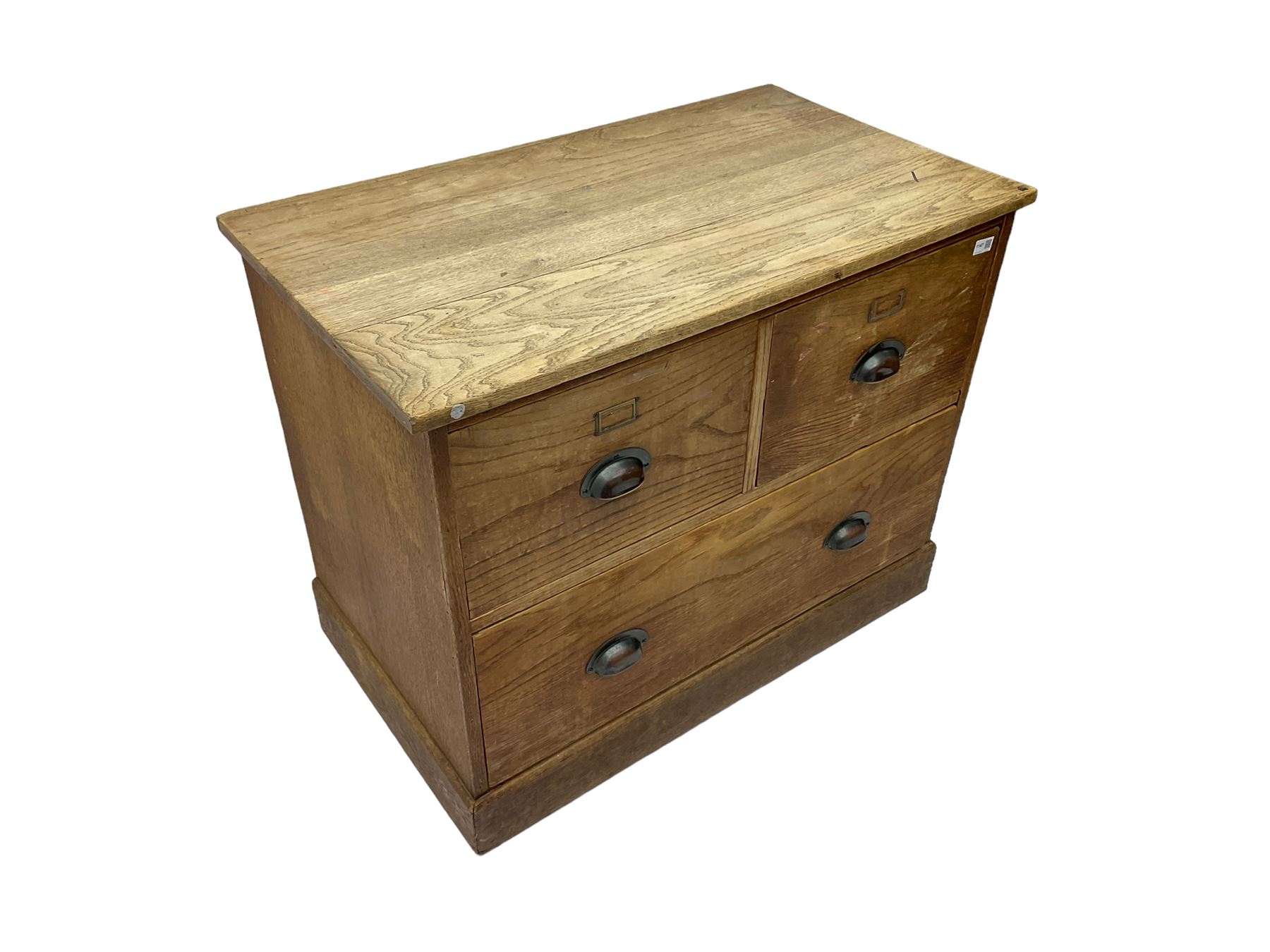 Early to mid-20th century oak chest, fitted with two short drawers over one long drawer, raised on plinth base