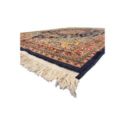 Belgian Sultan woollen ground rug, central navy field densely decorated with floral sprays and geometric patterns (192cm x 135cm); handwoven tribal terracotta ground rug (121cm x 71cm); Persian crimson ground runner, all over stylised floral and foliate motifs (266cm x 94cm)