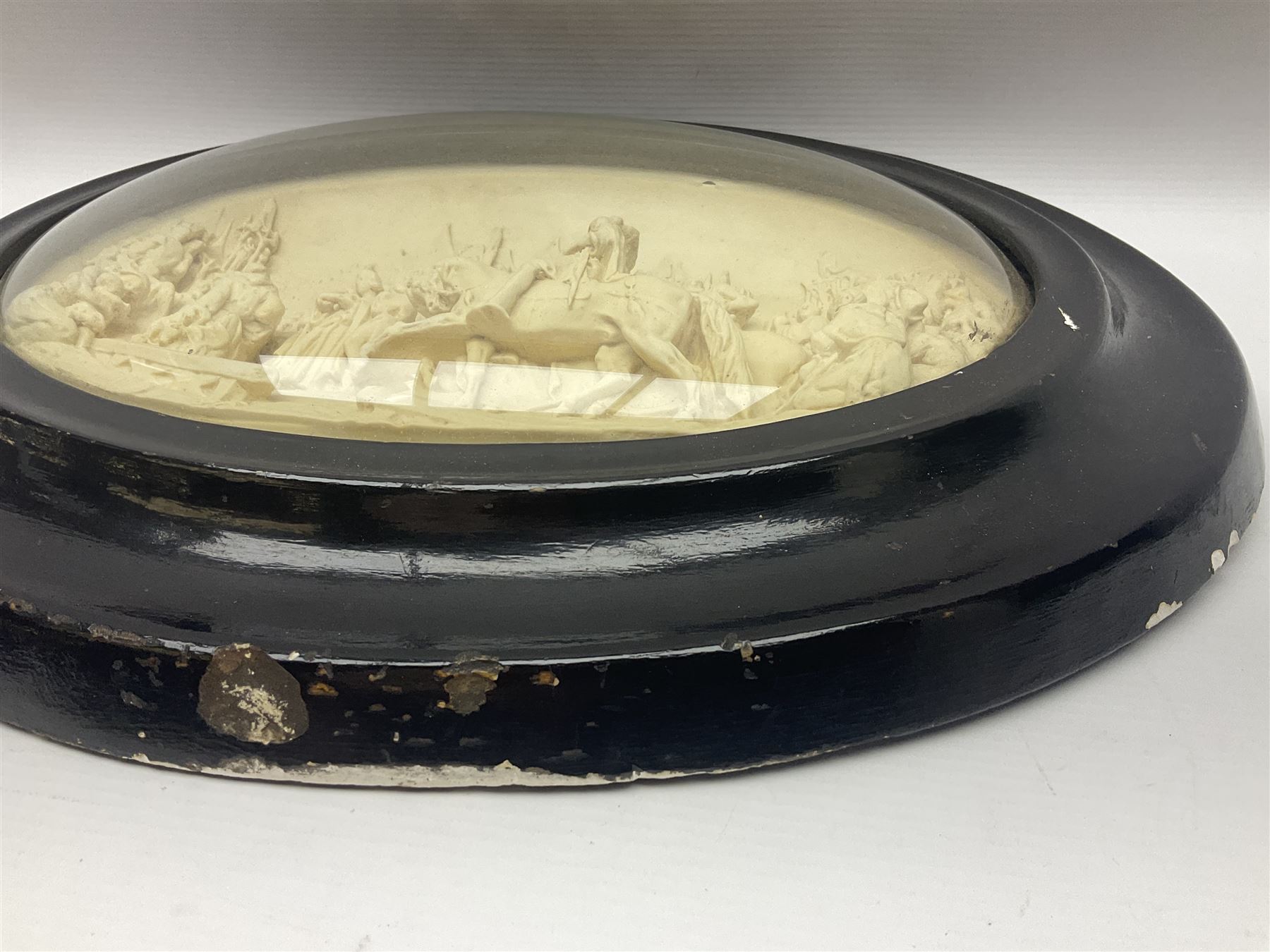 Justin Mathieu; oval high relief plaque depicting a battle scene, within frame H36cm