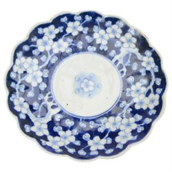Collection of Japanese and similar ceramics, including pair of Satsuma side plates, decorated with a crowd of figures, blue and white teapot with floral decoration, blue and white vase and plates, etc