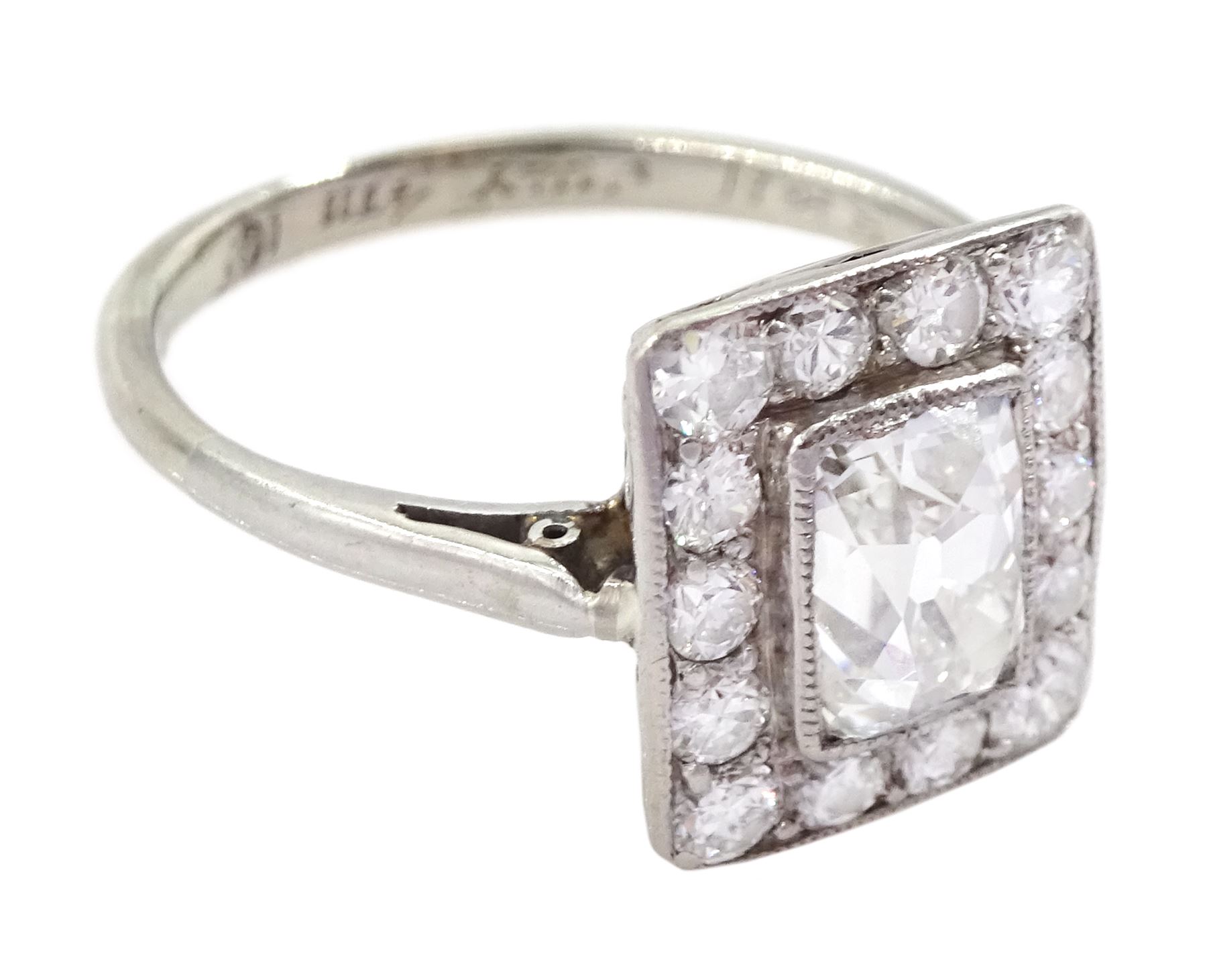 Art Deco platinum and white gold milgrain set diamond ring, circa 1920's, the central cushion cut diamond of approx 0.90 carat, with old cut diamond surround, total diamond weight approx 1.10 carat