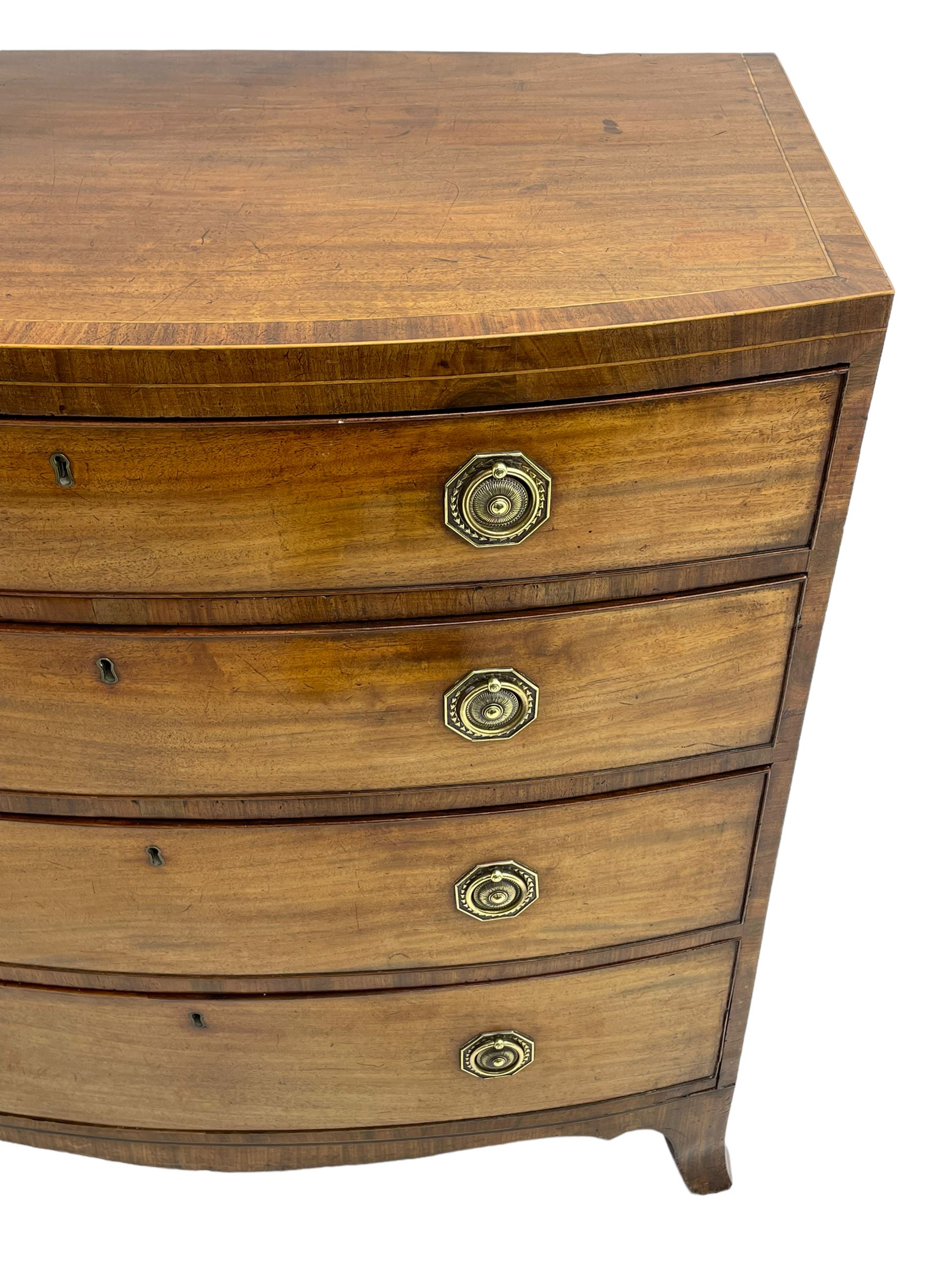 George III inlaid mahogany bow-front chest, fitted with four graduating drawers, octagonal plate and loop handles, shaped apron and splayed bracket feet