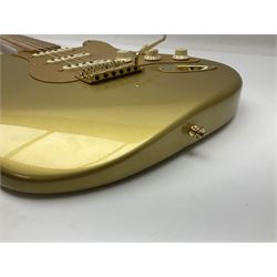 Fender Stratocaster 50th Anniversary 2004 metallic gold electric guitar; serial no.MZ4116369; L98cm; in Spider fitted case with owners manual and other paperwork, strap and belt buckle etc