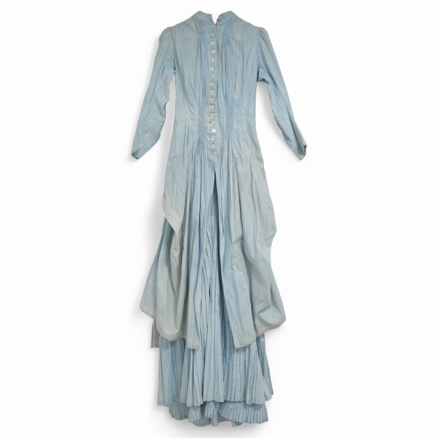 Victorian ladies button-down bodice and skirt, in blue and white striped fabric with pleated detailing, the skirt with gathered bustle back