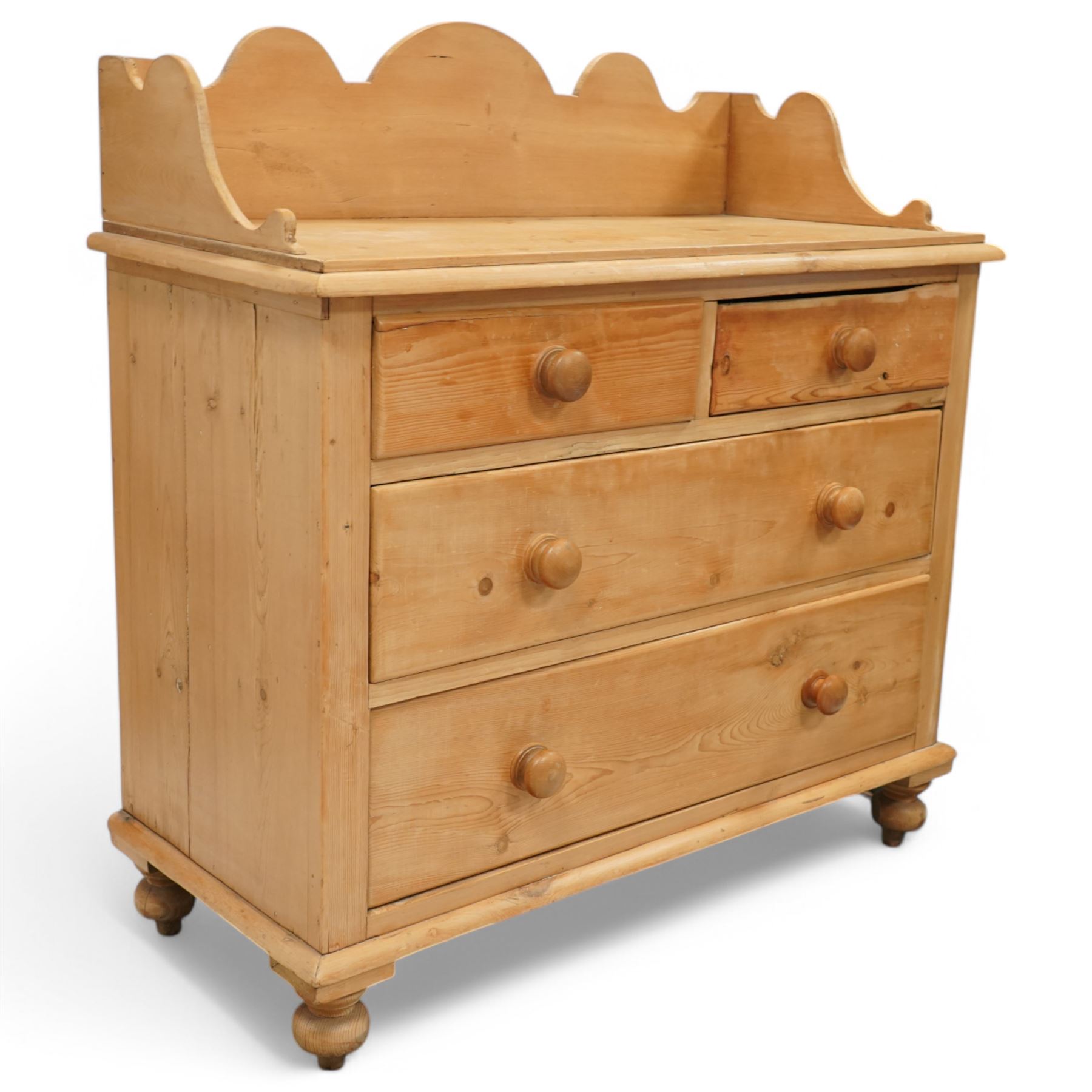 Victorian pine pot cupboard washstand, shaped arched gallery back with scroll carved ends, rectangular top over two short and two long drawers with turned wooden knobs, raised on squat turned feet