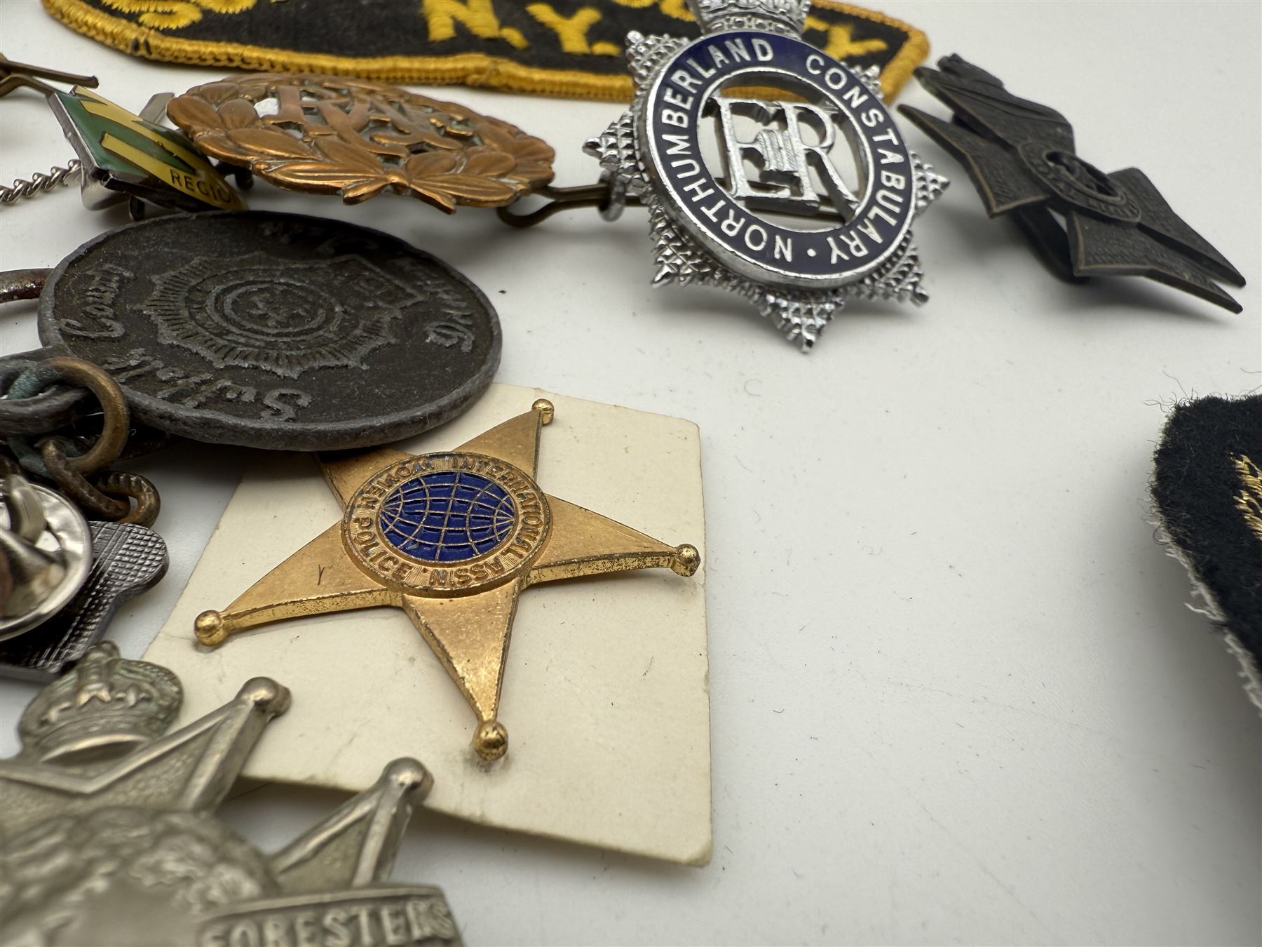 Collection of military and similar enamel badges, pin badges, cloth badges and brasses