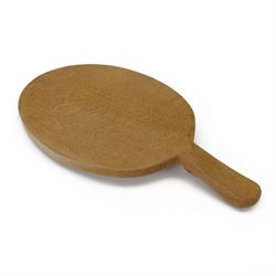 Mouseman - adzed oak cheeseboard, oval form with handle, carved with mouse signature, by the workshop of Robert Thompson, Kilburn