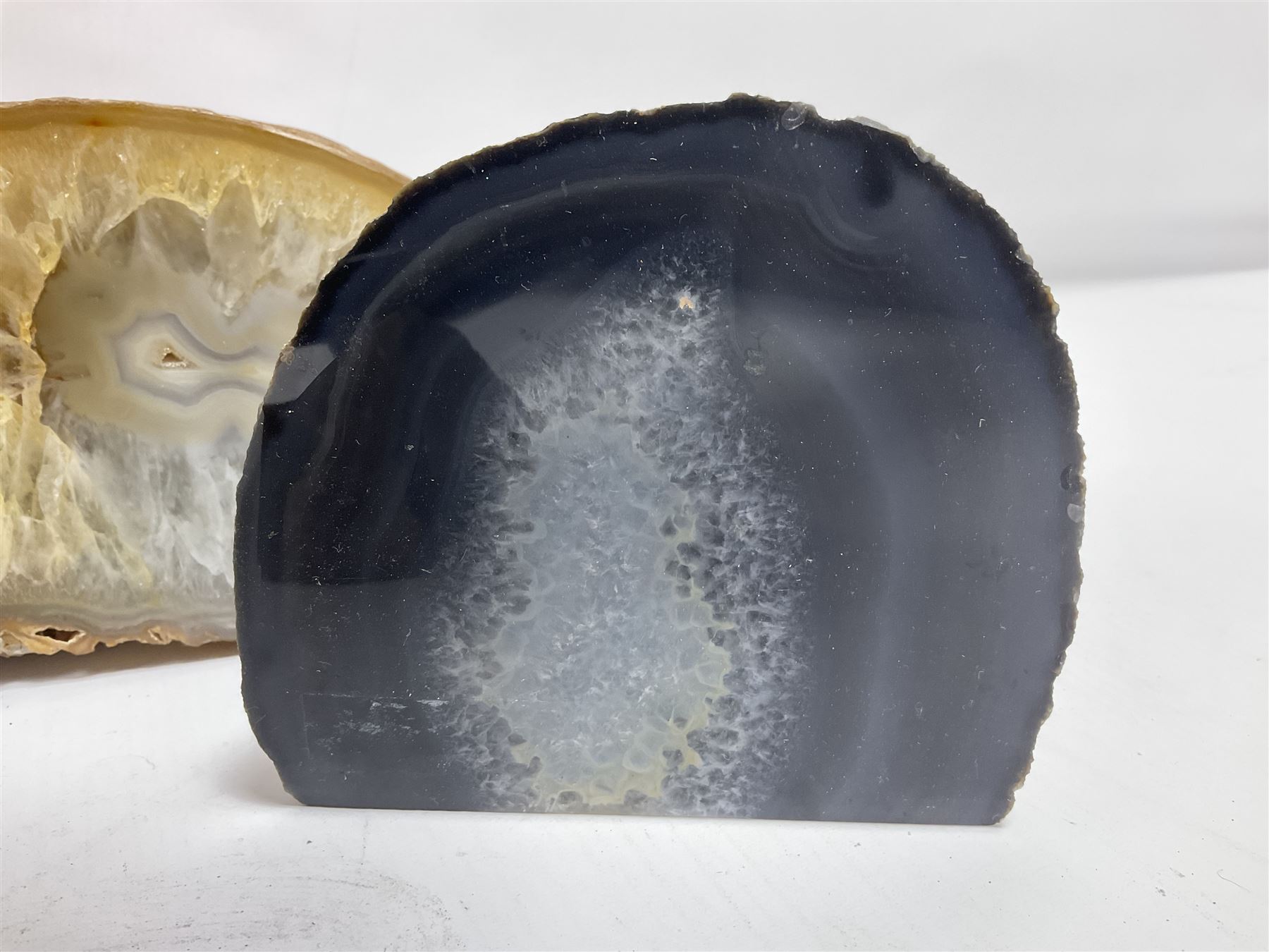 Four polished blue agate geodes, largest H10cm, L18cm