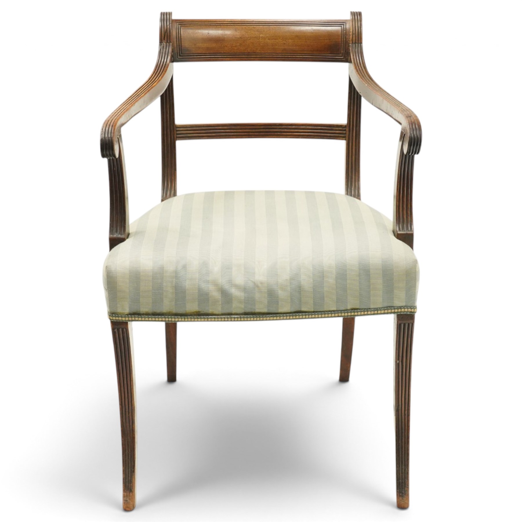 Georgian mahogany reeded carver armchair or elbow chair, bar back and scrolled arm terminals above over-stuffed seat, raised on sabre supports