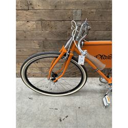 Fully restored vintage advertising bicycle with 2 stroke petrol engine, orange frame, tan leather seat