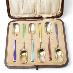 Set of six silver gilt coffee spoons with spade shape bowls, each stem with different coloured enamel and in original case Birmingham 1926/27 Maker Levi & Salaman