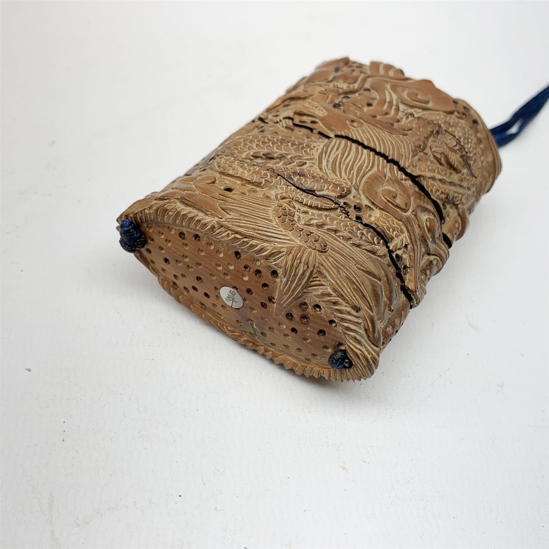 Japanese Meiji wooden four case inro, carved with dragons, with dragon netsuke and ojime bead, H8cm  