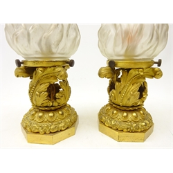  Pair of French Ormolu table lamps, the stem cast with beaded and writhen acanthus leaves, above a band of flowers and fruit, on octagonal brass base with frosted flambe shades, H33cm   