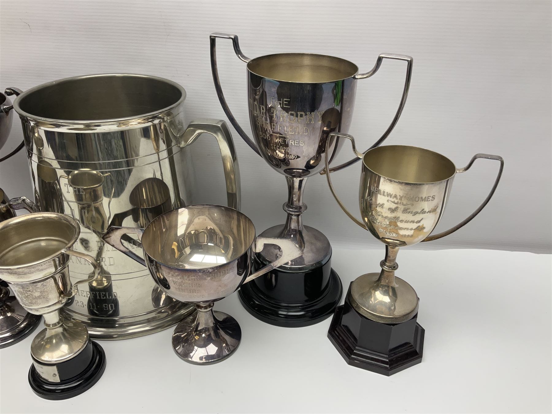 Collection of pewter and silver-plated trophy cups and presentation tankards, largest H28cm
