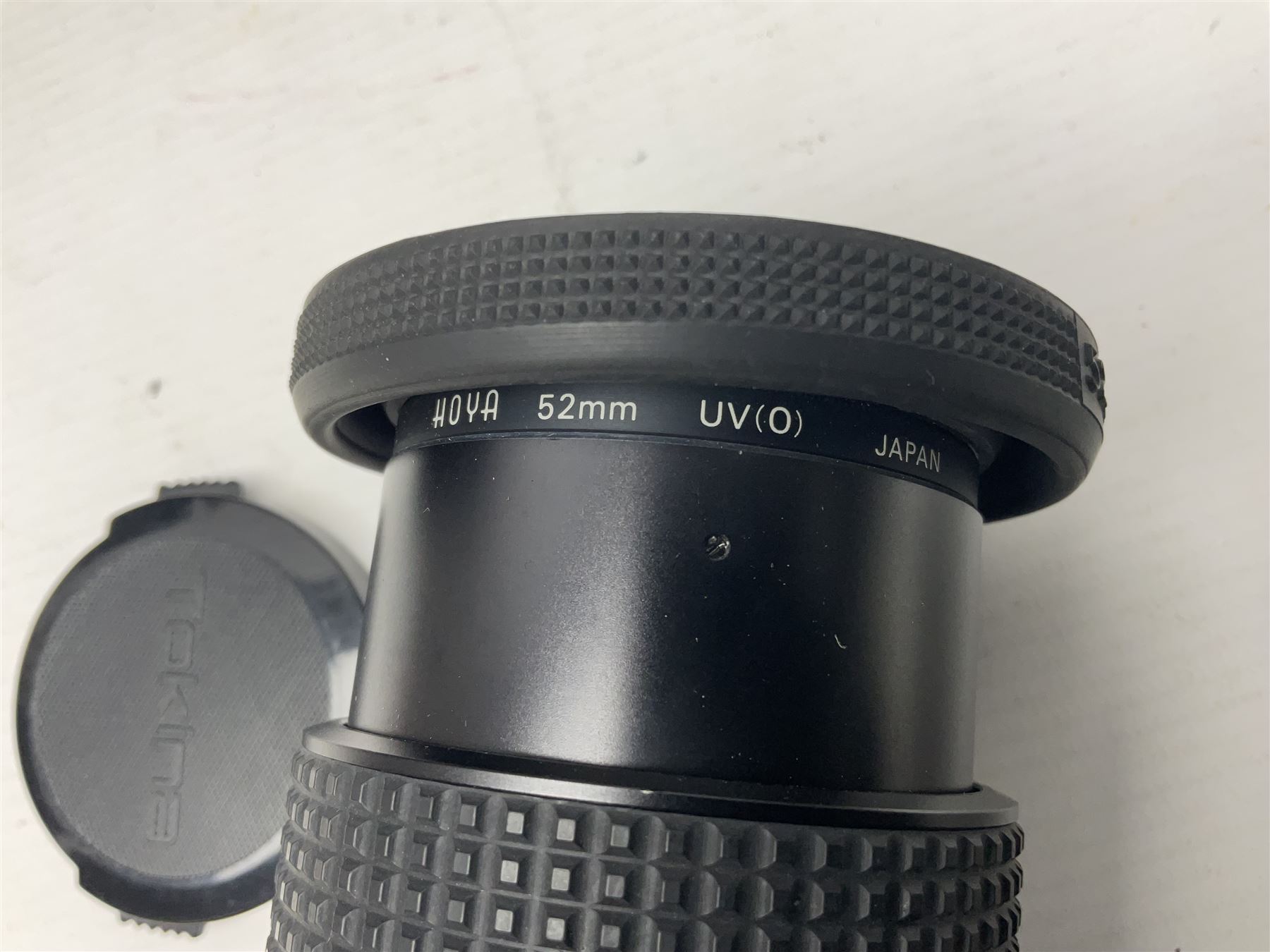 Canon A1 35mm camera body serial no 741264, with 'Tokina AT-X 28-85mm 1:3.5-4.5' lens serial no 821679, 'Canon FD 50mm 1:1.8mm' lens and other camera equipment 