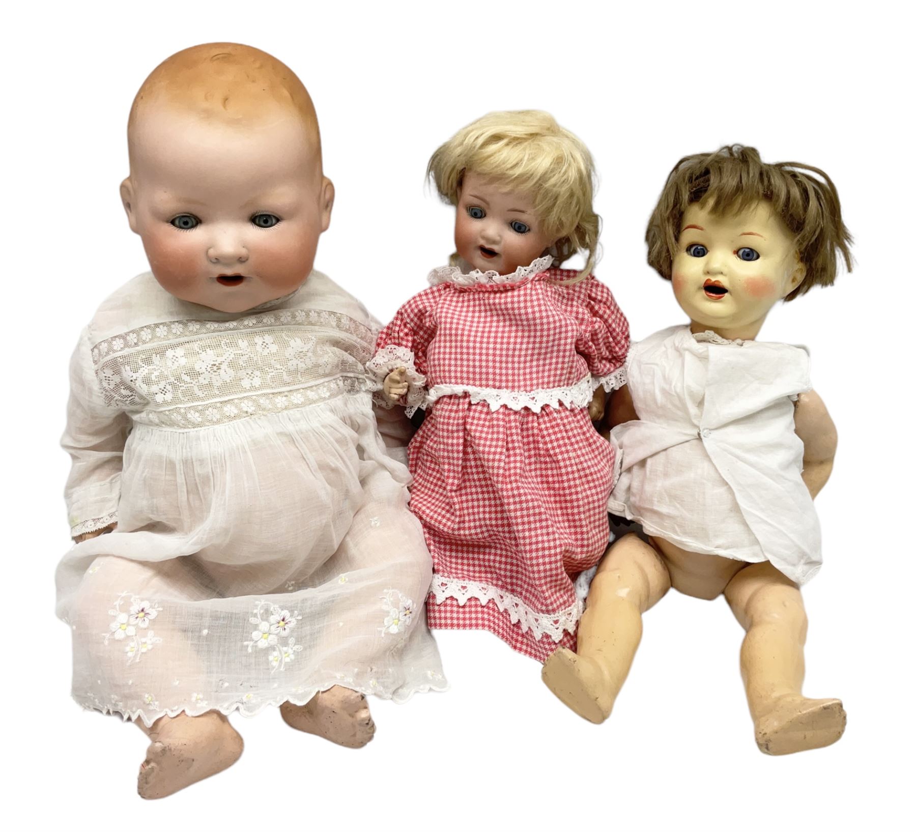 Heubach Koppelsdorf Germany bisque head doll with applied hair, sleeping eyes, open mouth with teeth and composition body with jointed limbs; marked 'Heubach Koppelsdorf 342.6/0 Germany' H34cm; Armand Marseille bisque head baby doll with moulded hair, sleeping eyes, open mouth and composition body with jointed limbs; marked 'A.M. Germany 351./8.K.; and BND London all composition doll (3)
