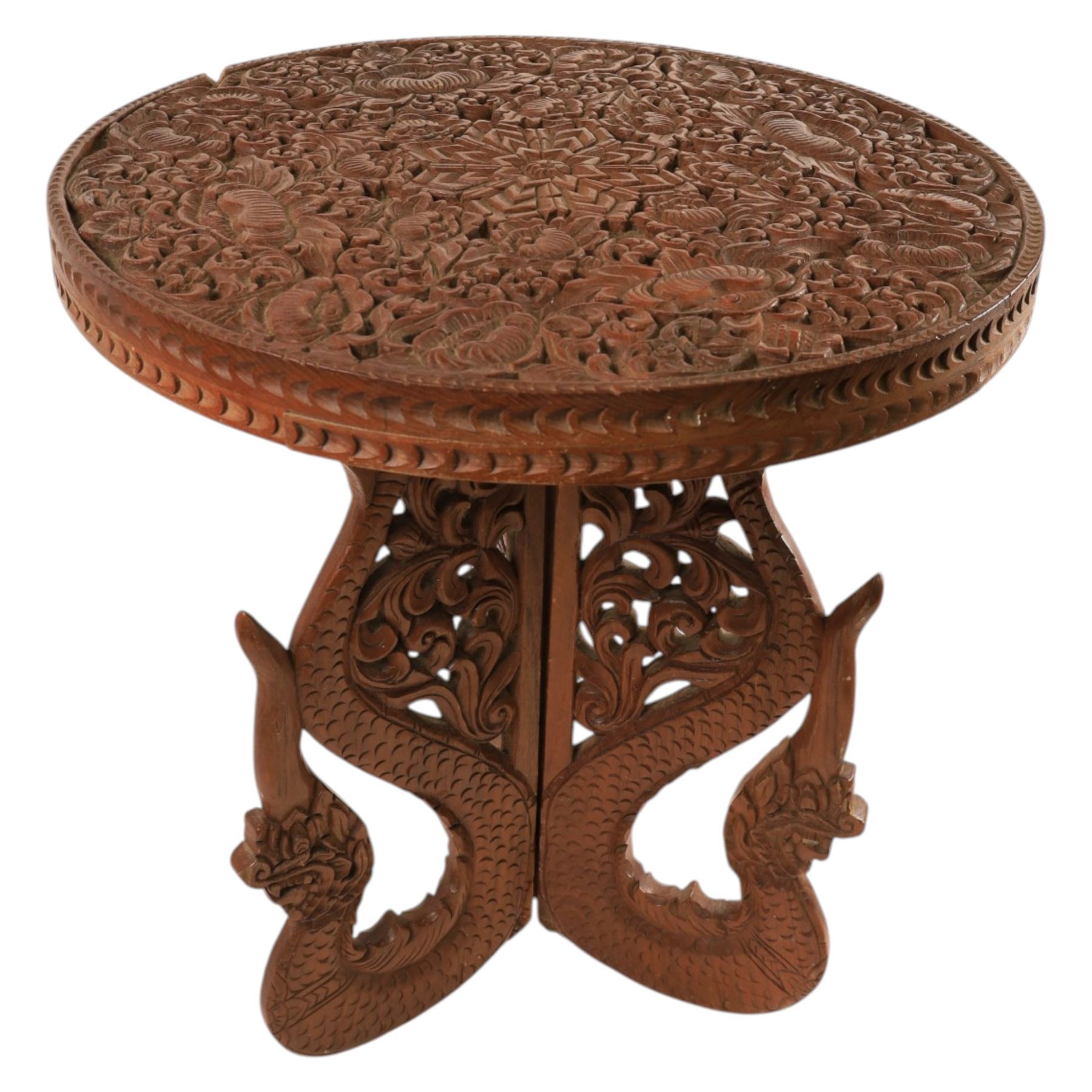 Carved side table, the top carved in relief with leaves and foliage, with folding legs, H53cm