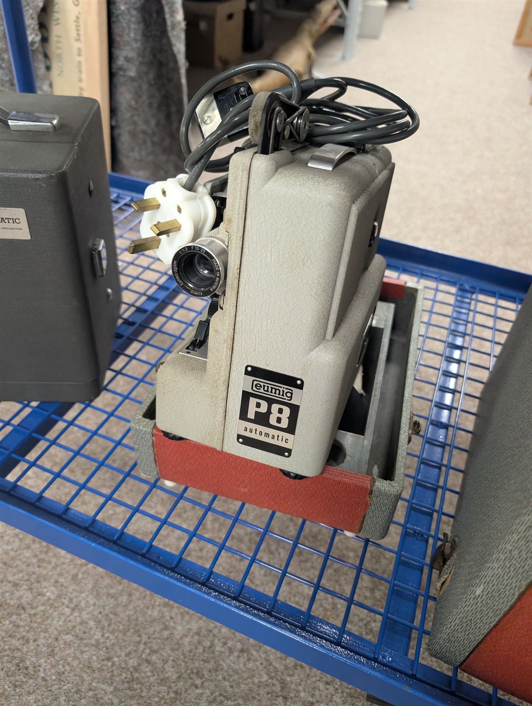 Collection of projectors, including Bell & Howell 613 cine projector, E J Arnold slide projector, Bolex home projector, Aldis 303, Bell & Howell Filmo 57 model projector, Leitz Wetzlar Pradovit Color, Kodak Instamatic M55L movie projector and a Gnome slide projector