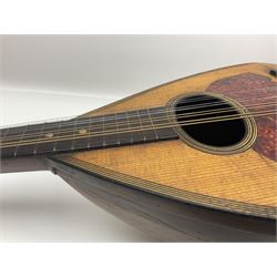 Late 19th century Italian lute back mandolin with segmented bowl back, bears label Gennaro Maglioni Napoli L61cm; in ebonised wooden case; together with another similar damaged Italian lute back mandolin for restoration or spares (2)