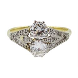 Early-mid 20th century two stone diamond ring, with diamond set shoulders, stamped 18ct, two principle diamonds approx 0.65 carat total