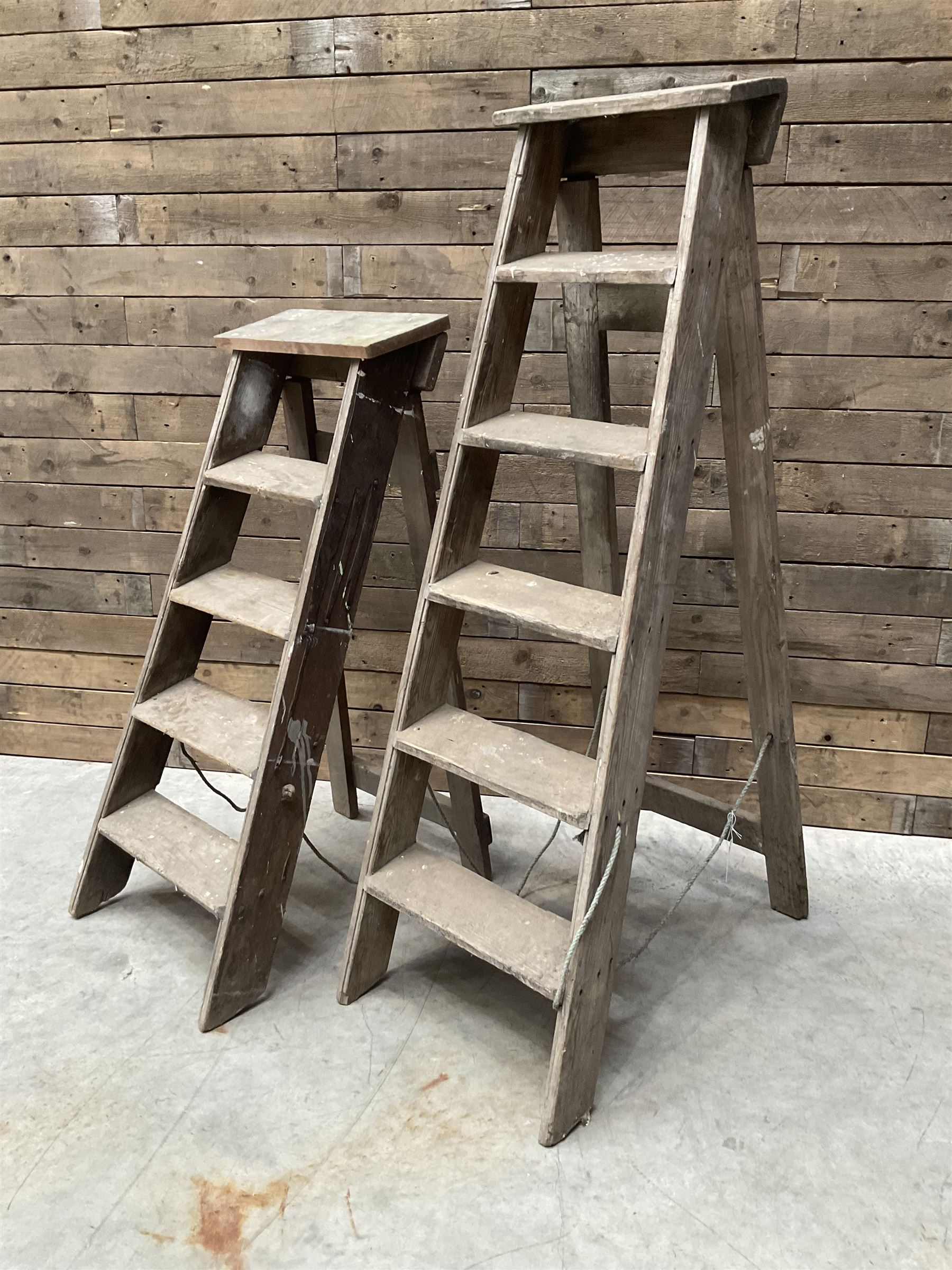Two antique wooden step ladders, H100cm and 140cm
