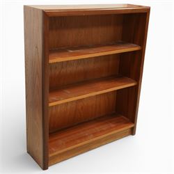 Mid 20th century teak bookcase, of rectangular form with plain top above three open shelves and a shaped plinth base