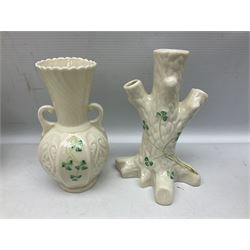 Five late 19th/early 20th century and later Belleek vases, comprising pair of Lotus Blossom examples, shamrock tree trunk vase, twin handled shamrock vase and a baluster form vase decorated with applied roses, all with printed marks beneath, tallest H16cm