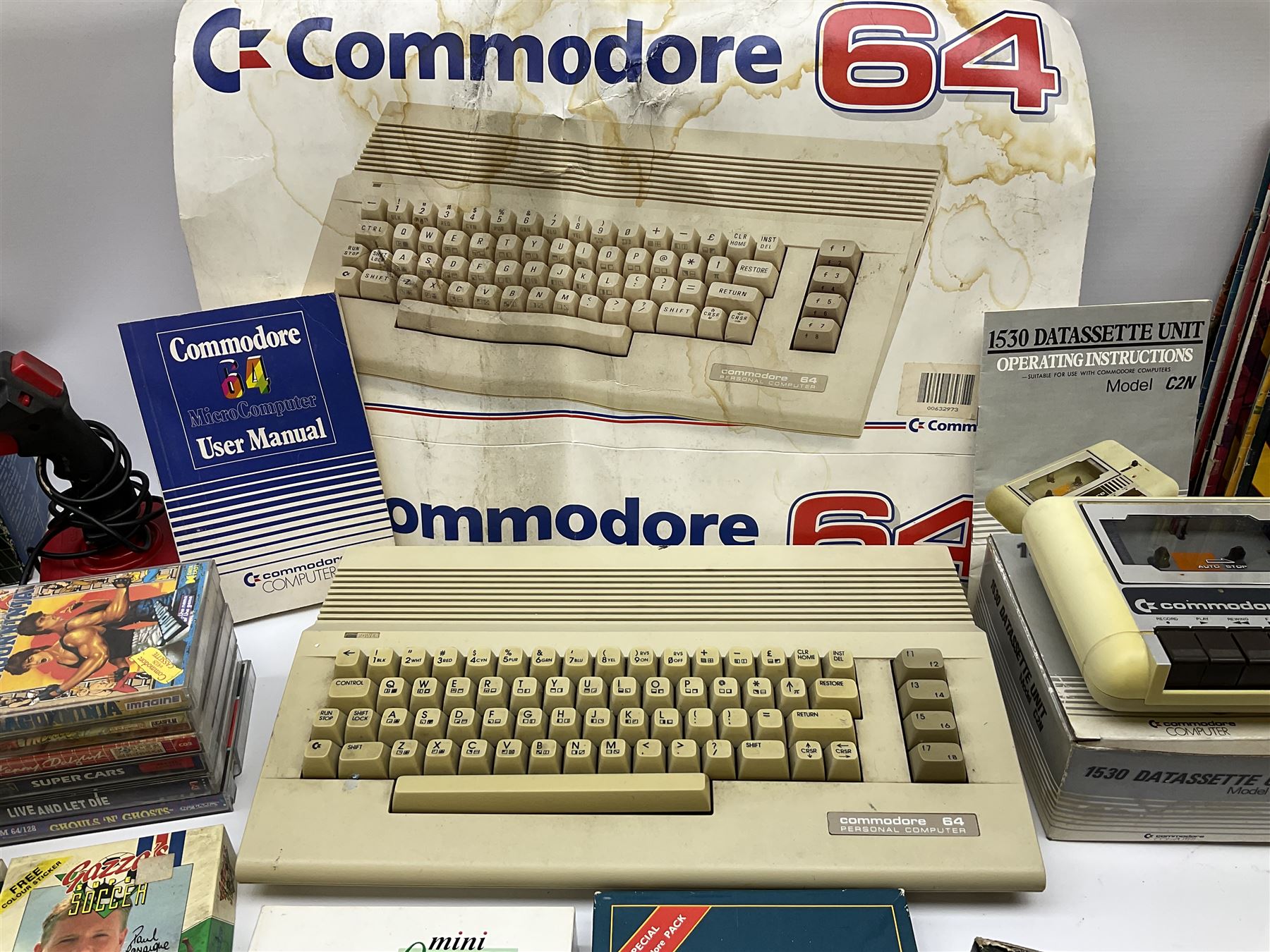 Commodore 64 games computer with boxed 1530 Datassette Unit Model C2N, two joysticks, over seventy games and twenty-two Commodore magazines; polystyrene box inner and card slip-case