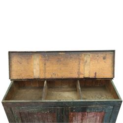 19th century painted and lacquered pine clerks desk bureau on cupboard, hinged fall-front enclosing three compartments, over slatted panelled doors enclosing two perforated shelves, on skirted base, in rustic forest green and red finish