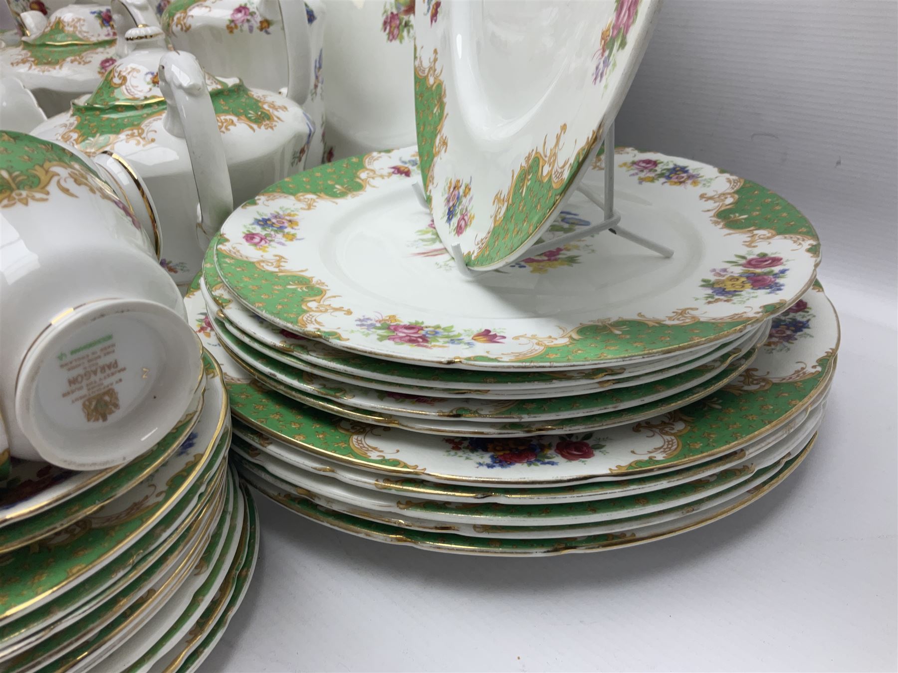 Paragon Rockingham pattern part tea and dinner service including three teapots, milk jug, cups and saucers of various sizes, ten soup bowls, ten side plates, ten dinner plates etc (96)